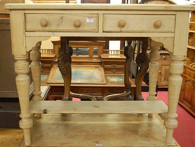 Lot 1409 - A reclaimed pine two drawer side table, on...