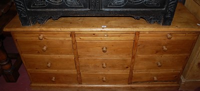 Lot 1413 - A reclaimed pine low side chest, fitted with...