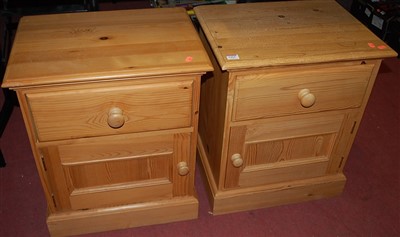 Lot 1424 - A pair of modern pine single door bedside...