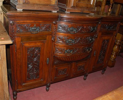 Lot 1439 - An Edwardian floral relief carved walnut...