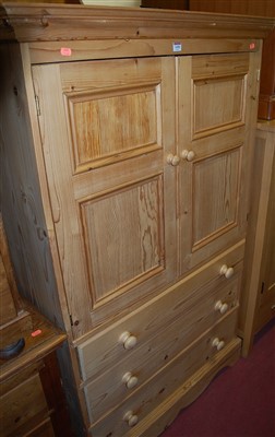 Lot 1450 - A modern pine tallboy chest, having twin...