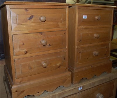 Lot 1460 - A pair of modern pine three drawer bedside...