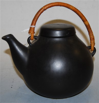 Lot 2 - An Arabia ceramic teapot and cover, on a black...