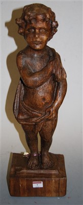 Lot 7 - A large carved oak figure of a cherub, in...