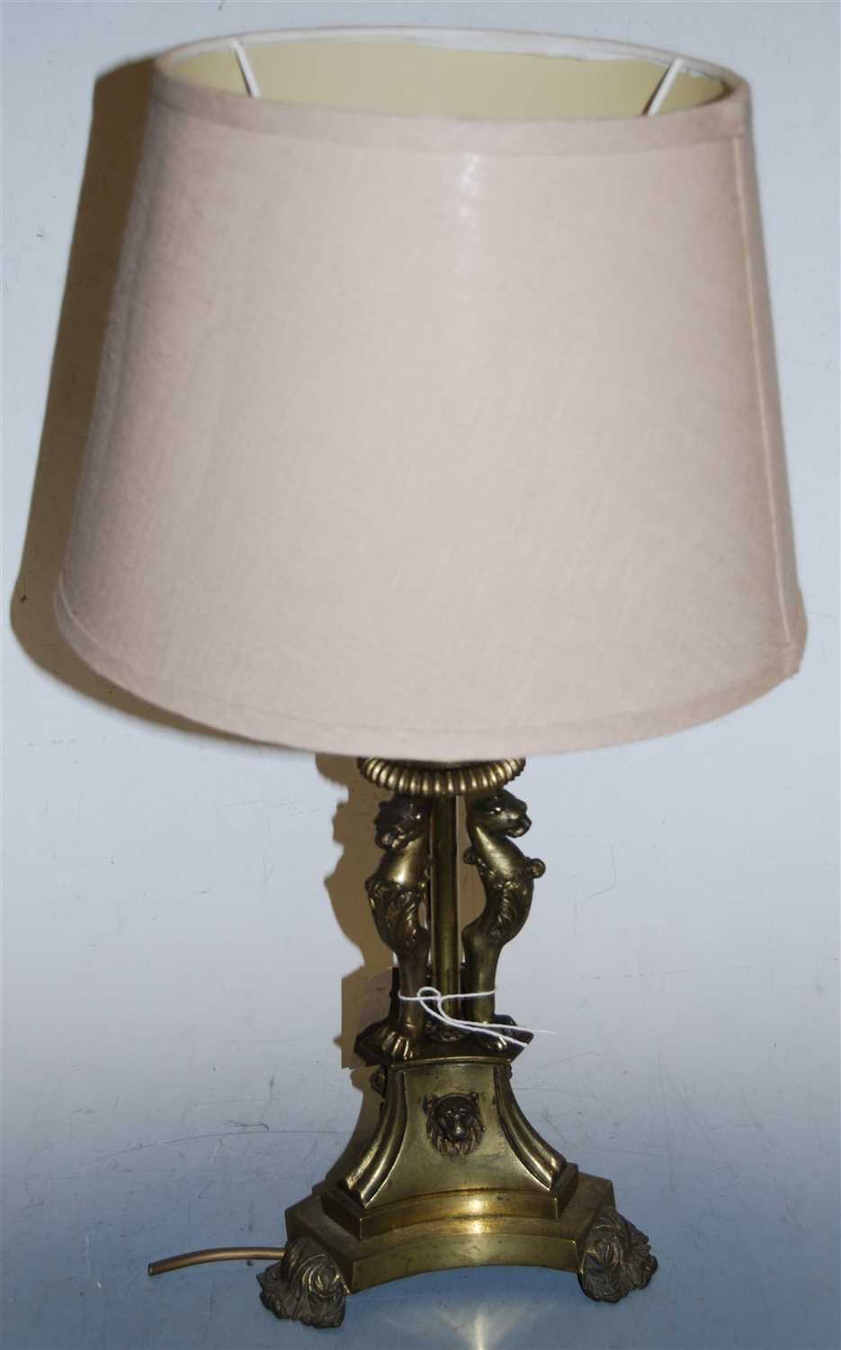 Lot 10 - A brass table lamp and shade, having acanthus...