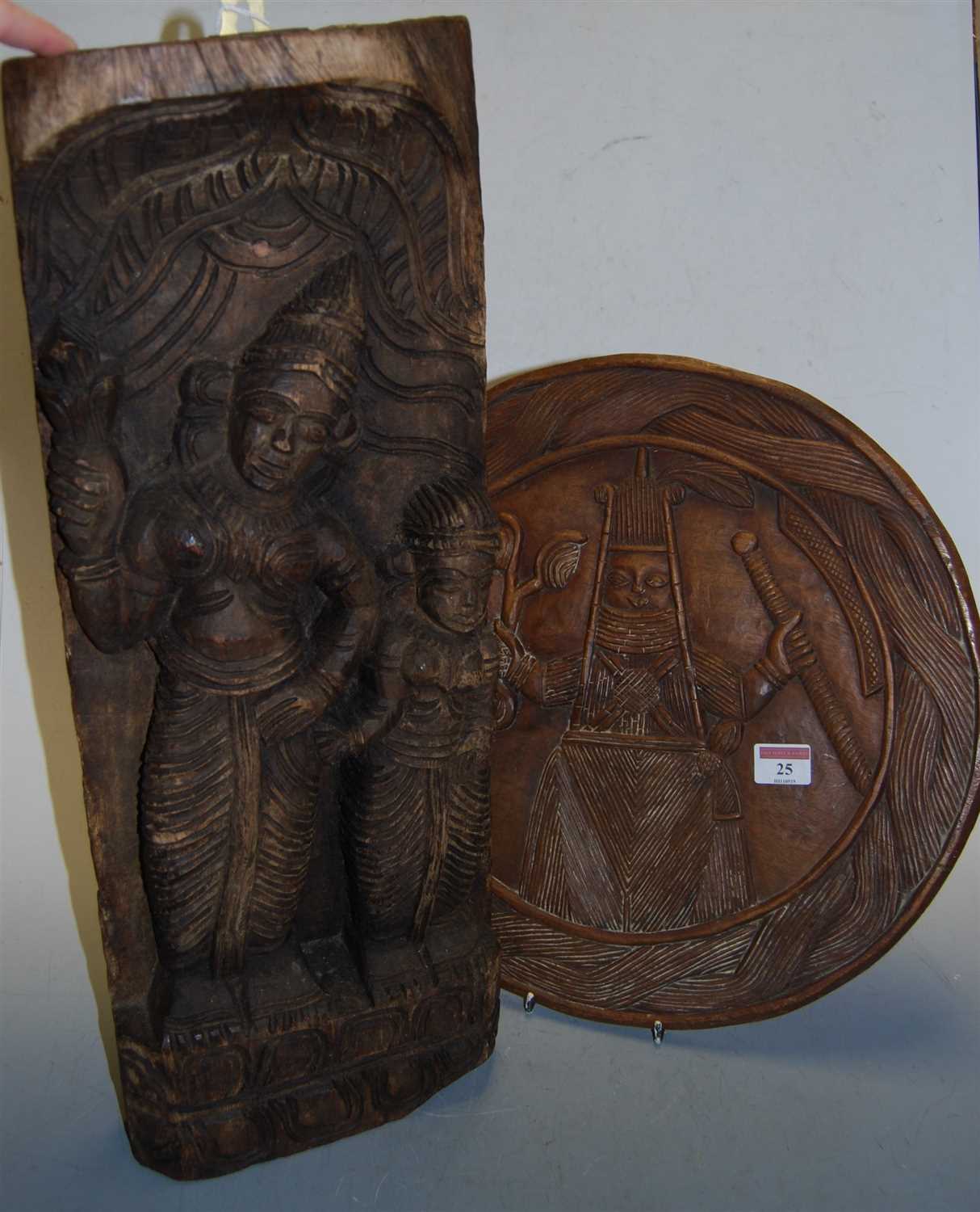 Lot 25 - An oak panel, relief carved with a deity;...