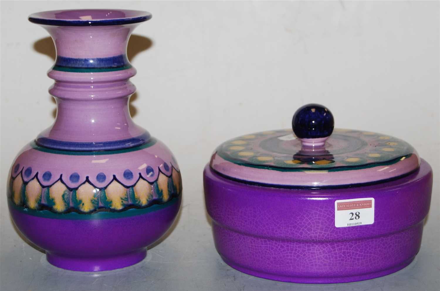Lot 28 - A Lila Flora Dutch pottery vase, on a purple...