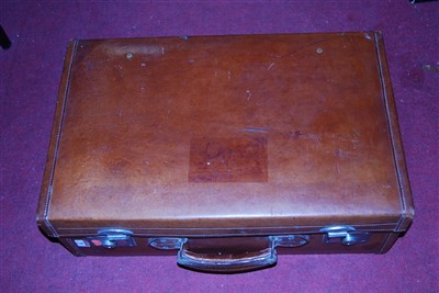 Lot 78 - A brown stitched leather suitcase, with silk...