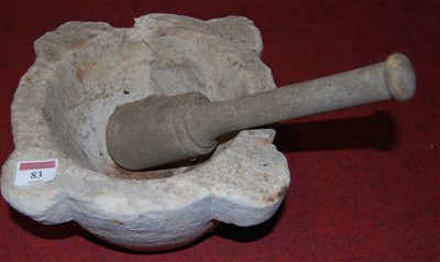 Lot 83 - A marble mortar with wooden pestle