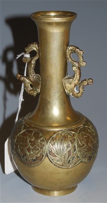 Lot 180 - A Japanese brass and embossed bottle vase, 18cm