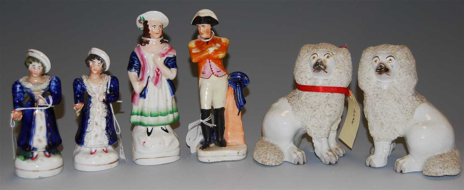 Lot 182 - A pair of Staffordshire seated poodles, late...