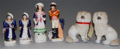 Lot 182 - A pair of Staffordshire seated poodles, late...