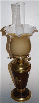 Lot 100 - A 1920s oak and brass pedestal oil lamp,...