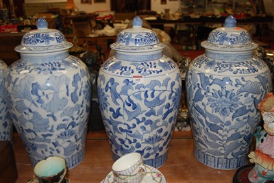Lot 103 - A set of four large blue and white jars and...
