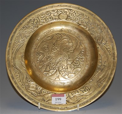 Lot 199 - A Japanese brass plate with embossed...