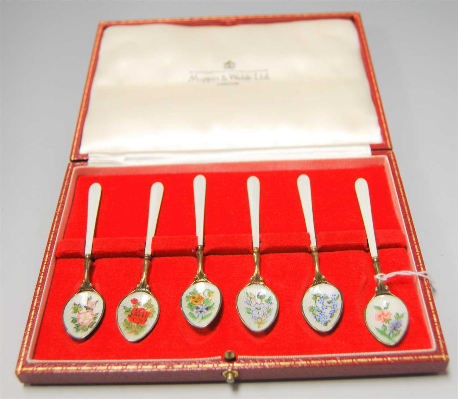 Lot 256 - A cased set of six modern silver gilt and...