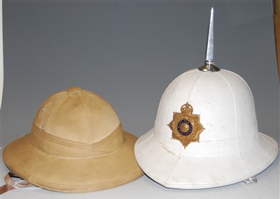 Lot 420 - A white cloth covered pith helmet, with...