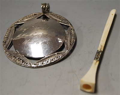 Lot 424 - A German white metal christening pendant,...