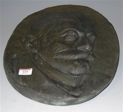 Lot 429 - A large oval portrait plaque depicting Stalin,...