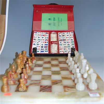 Lot 458 - A modern onyx chessboard with chess pieces;...