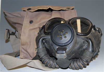 Lot 459 - A post-WWII United States issue gas mask, in...