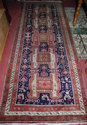 Lot 1140 - A Persian woollen hand-knotted Meshkin runner,...