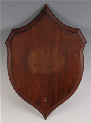 Lot 478 - An early 20th century oak shield shaped plinth