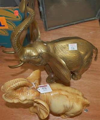 Lot 576 - A brass elephant and a resin elephant (2)