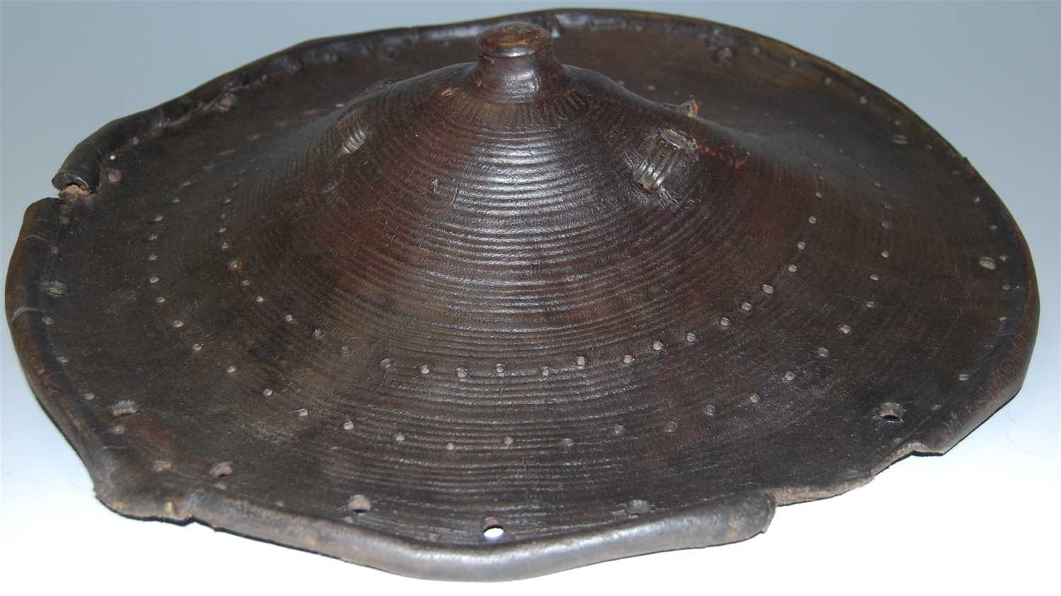 Lot 439 - An Indo-Persian leather dhal shield