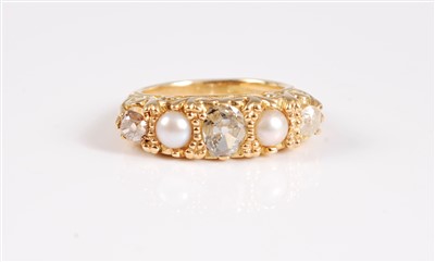 Lot 2285 - An 18ct gold diamond and split pearl ring, the...