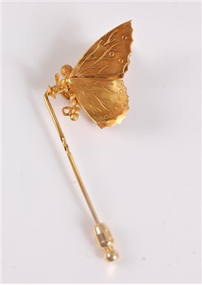 Lot 1326 - A butterfly stick pin, the naturalistically...