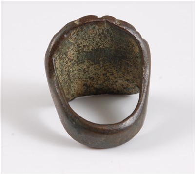Lot 1291 - A bronze mask ring, possibly Roman, the face...