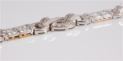 Lot 1246 - An Art Deco diamond bracelet, with a repeating...