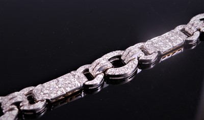 Lot 1246 - An Art Deco diamond bracelet, with a repeating...