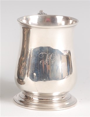 Lot 1205 - A George II silver tankard, of bell shape,...