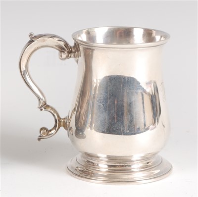 Lot 1205 - A George II silver tankard, of bell shape,...