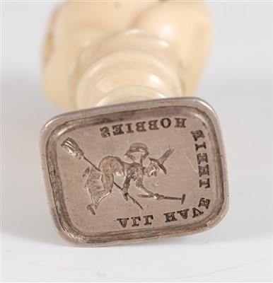 Lot 1355 - A 19th century carved ivory fist and ball seal,...