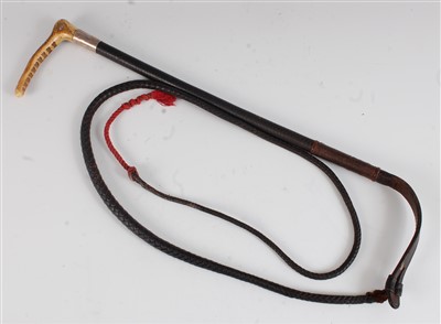 Lot 357 - An early 20th century plaited leather clad riding crop