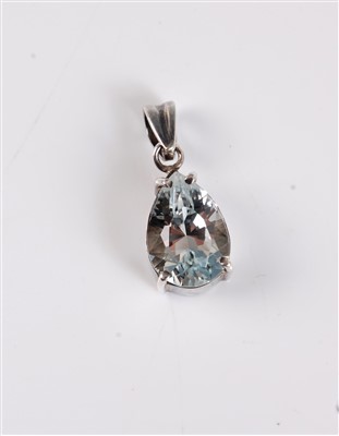 Lot 2638 - A topaz pendant, the pear shaped pendant...