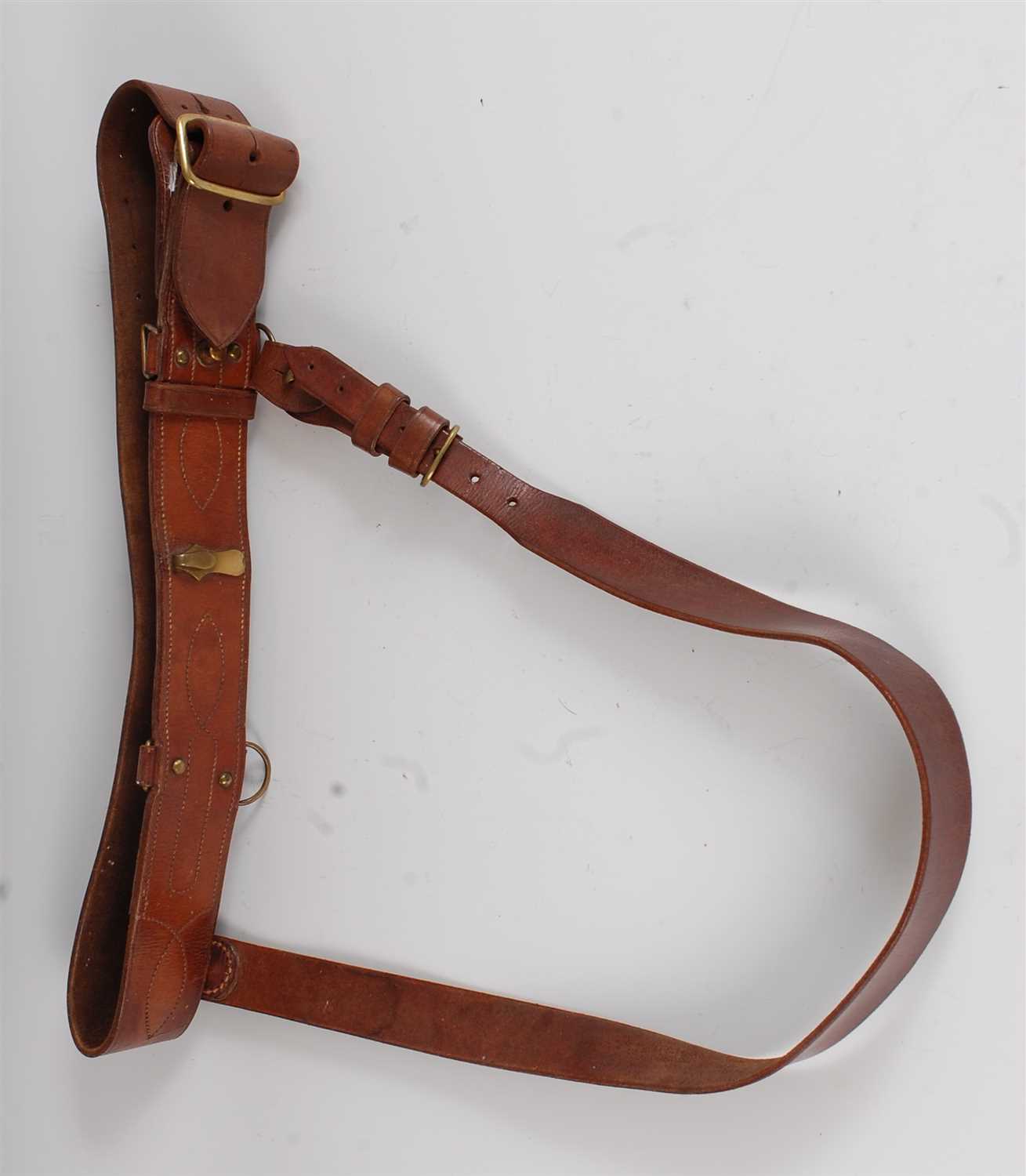 Lot 24 - A brown leather Sam Browne belt with brass fittings.