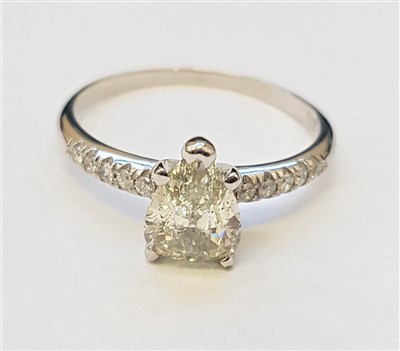 Lot 1312 - A 14ct pear shaped diamond ring, the pear...