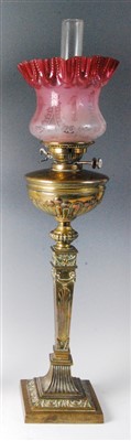 Lot 1402 - A late Victorian brass pedestal oil lamp,...