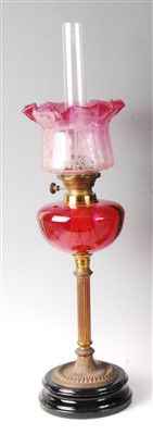 Lot 1403 - A late Victorian brass and cranberry glass...