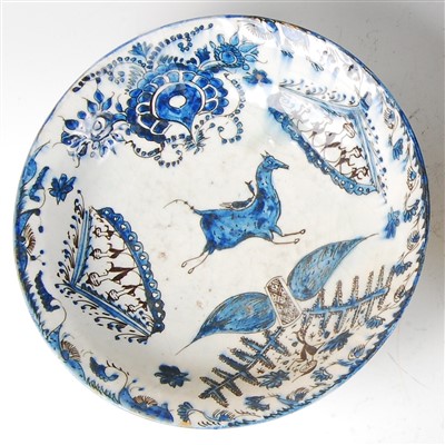 Lot 1432 - An 18th / 19th century Persian glazed pottery...