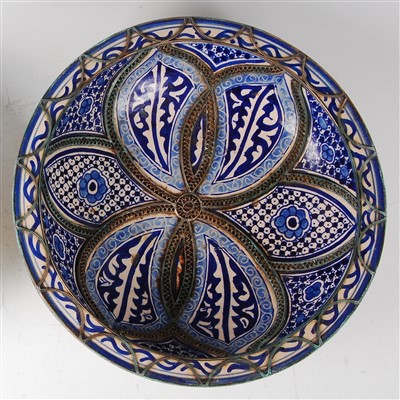 Lot 1433 - A large Persian blue and white decorated...