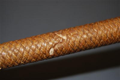 Lot 338 - An early 20th century plaited leather clad riding crop