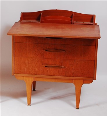 Lot 456 - A 1960s teak writing desk, in the form of a...