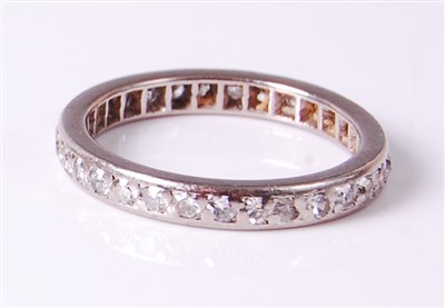 Lot 2675 - A white metal diamond eternity ring, arranged...