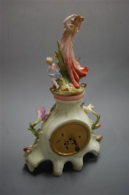 Lot 3 - A German porcelain cased mantel clock, having...