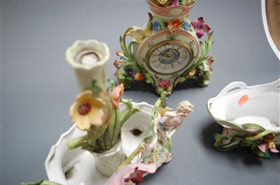 Lot 3 - A German porcelain cased mantel clock, having...